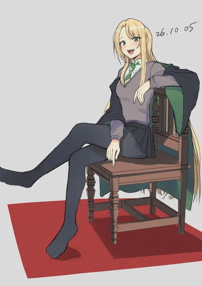 Girl Draco in Slytherin uniform and dark tights sitting sideways on a wooden chair, laughing